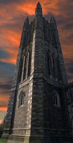 Low angle view of building against sky during sunset