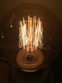 Close-up of illuminated light bulb