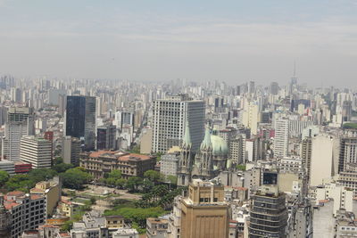 High angle view of buildings in city against sky