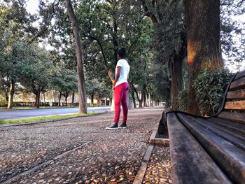 Woman standing alone in the park