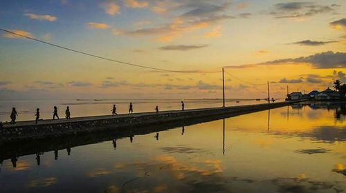 Scenic view of sea at sunset