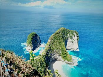 High angle view of rocks on beach against sky