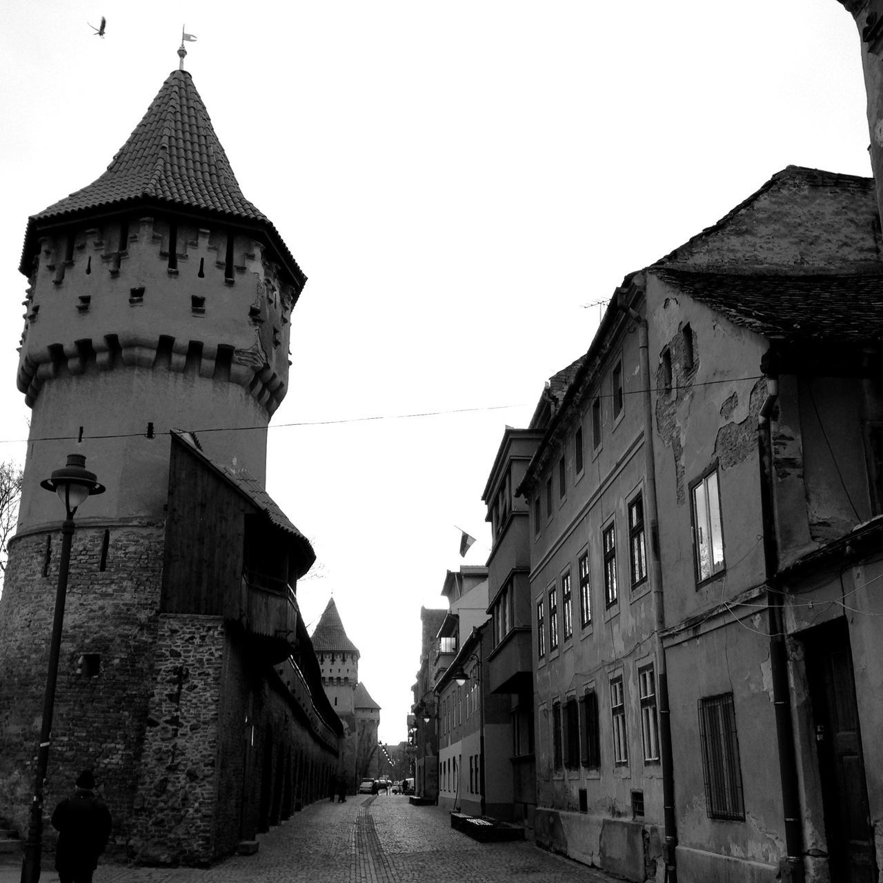 architecture, built structure, building exterior, clear sky, the way forward, religion, place of worship, street, church, road, transportation, spirituality, travel destinations, incidental people, diminishing perspective, travel, history, famous place, outdoors