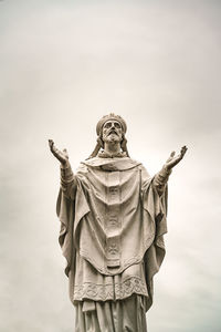 Low angle view of statue against sky