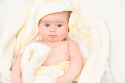 Cute baby girl in towel