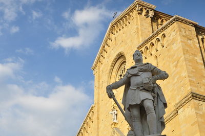 Low angle view of statue against sky