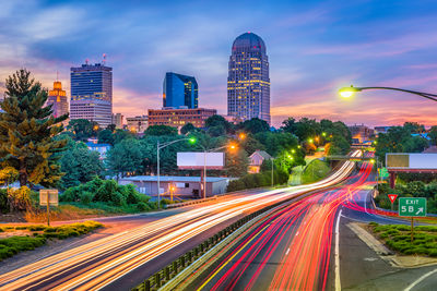 High angle view of light trails on road at night