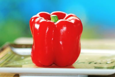 Close-up of red chili peppers on table