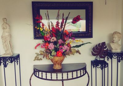 Flower vase on table at home