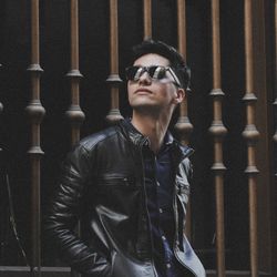 Portrait of young man wearing sunglasses standing outdoors