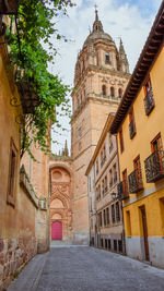 Alley amidst buildings in city