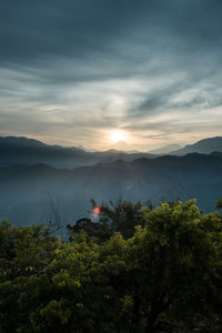 Scenic view of mountains against sky during sunset