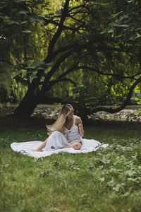 Woman sitting on a field