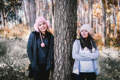 Portrait of a smiling young woman in forest