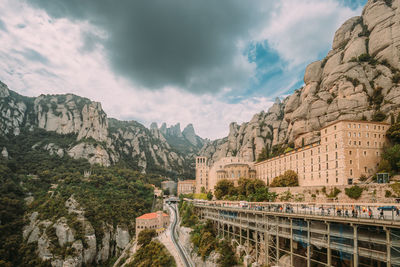 Panoramic view of bridge and mountains against sky