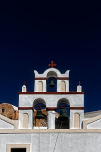 Low angle view of building against clear blue sky