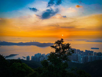 High angle view of buildings against sky during sunset