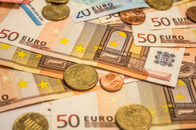 Close-up of coins on table