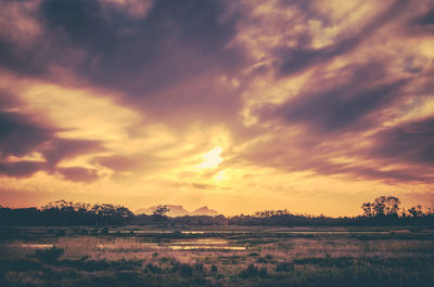 Scenic view of landscape against sky during sunset