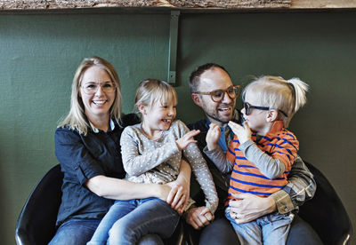 Happy family at eyeglasses workshop