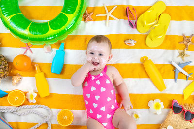 Portrait of cute girl playing with toys on table