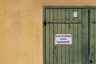 Information sign on wall of building