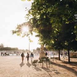 People at beach against sky