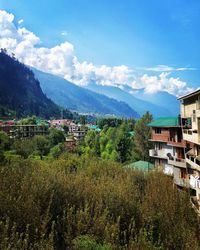 Scenic view of manali and mountains against sky