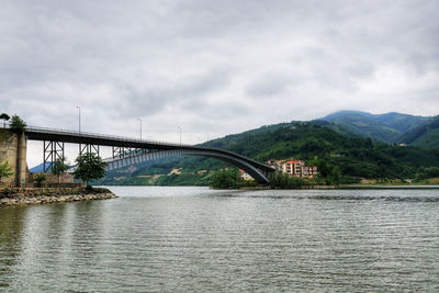 Bridge over river against sky