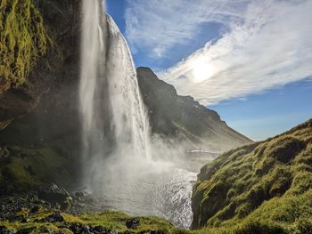 A beautiful waterfall and a dramatic sky in southern iceland 