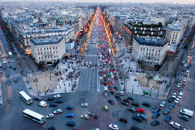 High angle view of busy street amidst buildings in city