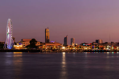 Illuminated buildings at waterfront