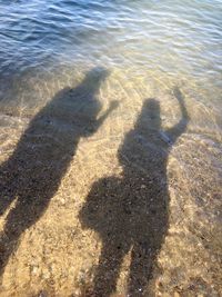 High angle view of shadow on sand at beach