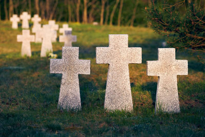Granite stone crosses in german military cemetery in europe. memorial for dead soldiers