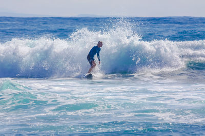 Man surfing in sea