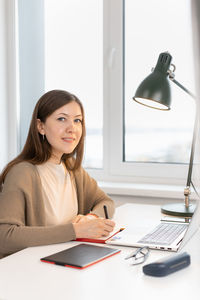 Portrait of businesswoman working at office