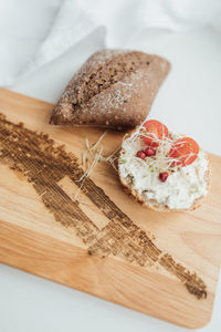 High angle view of bread on cutting board