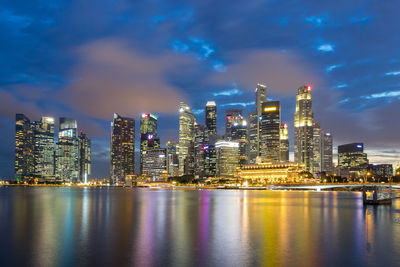 Illuminated city at waterfront