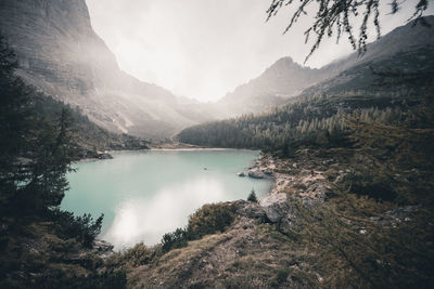 Scenic view of lake and mountains against sky