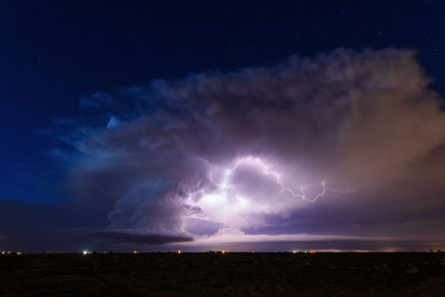Supercell storm clouds illuminated by lightning strikes near littlefield, texas