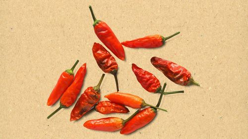 High angle view of red chili peppers on table