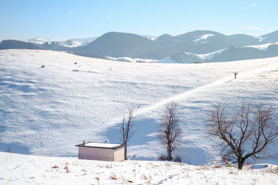 Sun over the winter mountains with snow, cindrel mountains, paltinis, romania