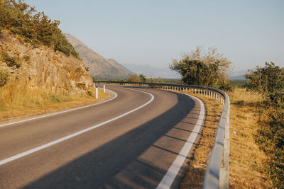 Empty road against clear sky