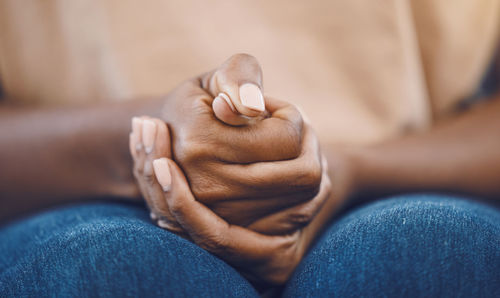 Midsection of woman holding hands