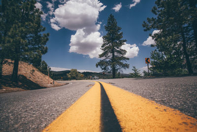 Surface level of empty road against sky