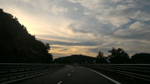 Empty road at sunset