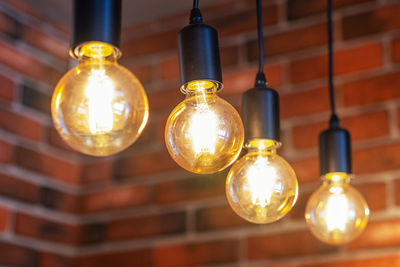 Low angle view of illuminated light bulb