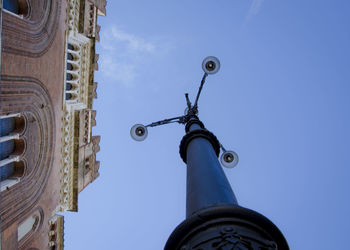 Low angle view of eiffel tower against blue sky