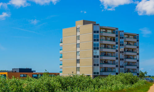Low angle view of building against blue sky