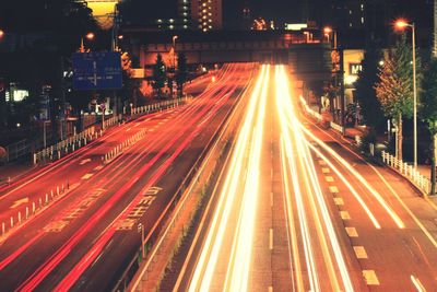 High angle view of light trails on city street at night